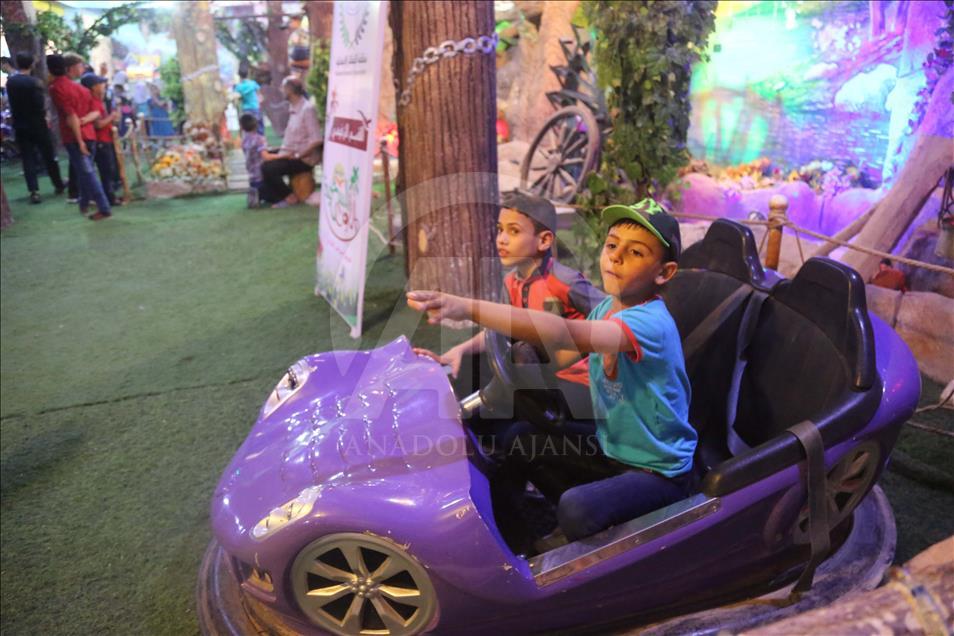 Syrian children at underground amusement park in Syria