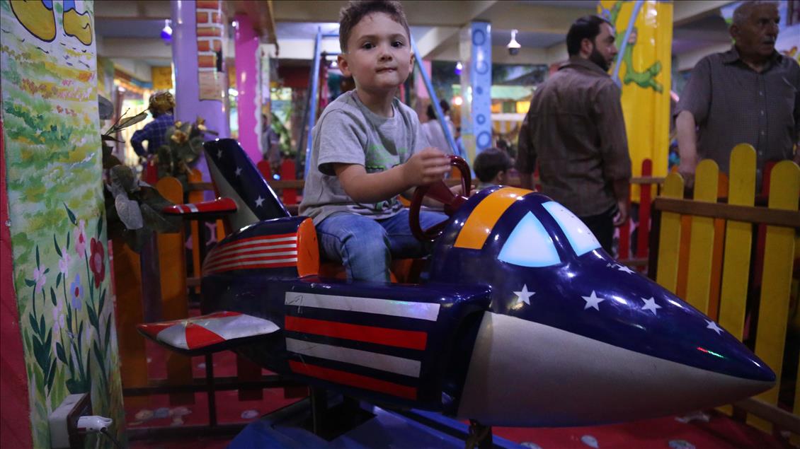 Syrian children at underground amusement park in Syria