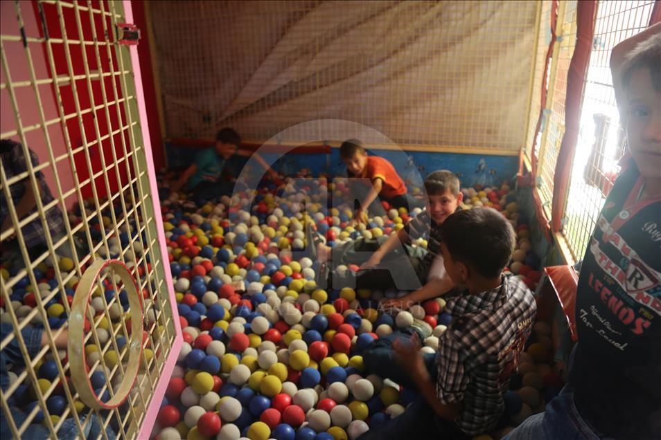 Syrian children at underground amusement park in Syria