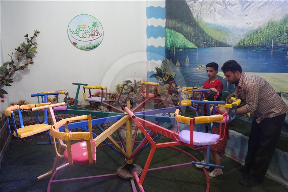 Syrian children at underground amusement park in Syria
