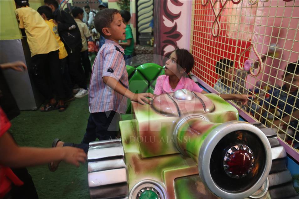 Syrian children at underground amusement park in Syria