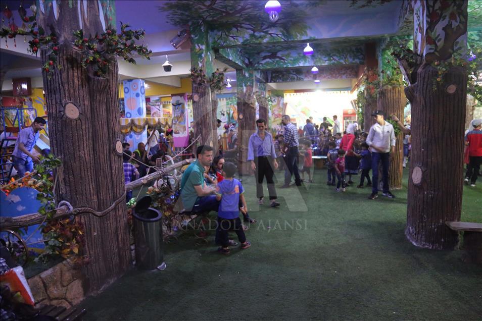 Syrian children at underground amusement park in Syria