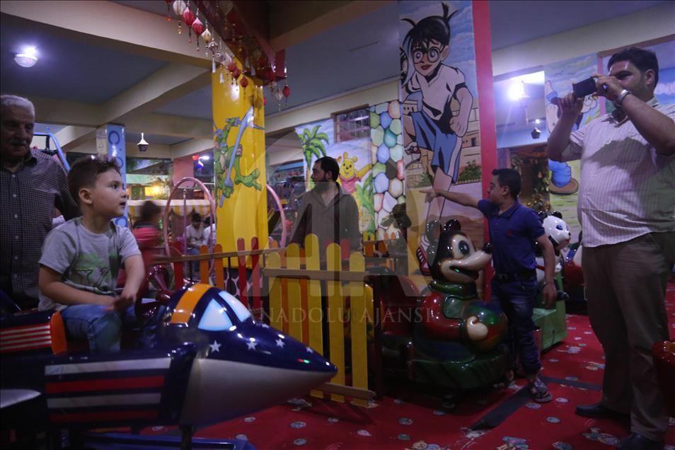 Syrian children at underground amusement park in Syria