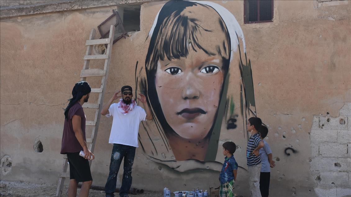 Türk grafiti sanatçılarından Suriye'de anlamlı çizimler