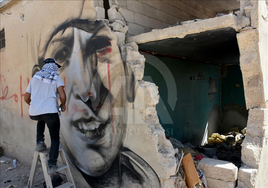 Türk grafiti sanatçılarından Suriye'de anlamlı çizimler