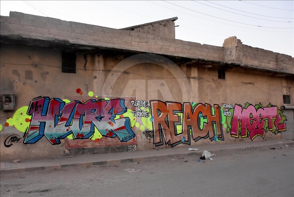 Türk grafiti sanatçılarından Suriye'de anlamlı çizimler