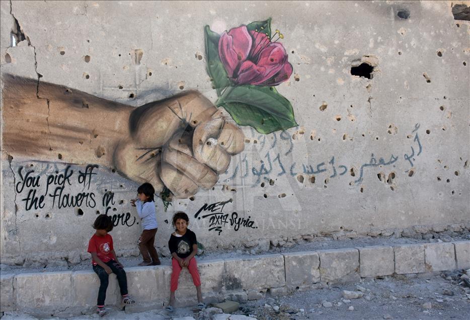 Türk grafiti sanatçılarından Suriye'de anlamlı çizimler