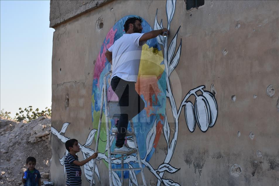 Türk grafiti sanatçılarından Suriye'de anlamlı çizimler