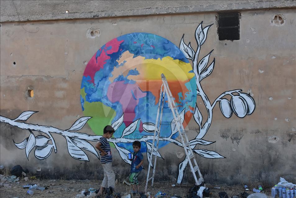 Türk grafiti sanatçılarından Suriye'de anlamlı çizimler