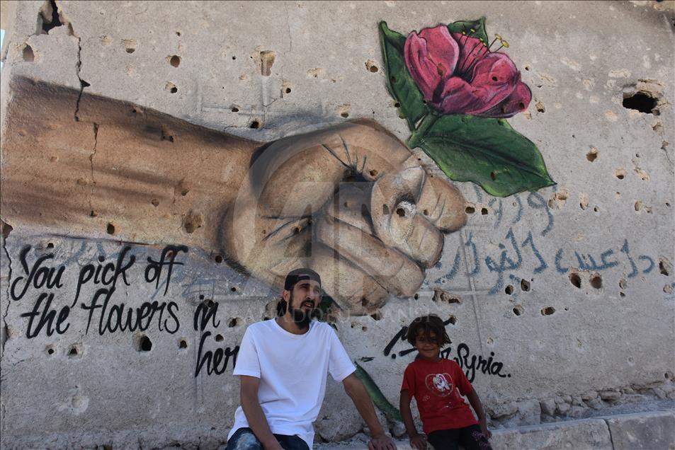Türk grafiti sanatçılarından Suriye'de anlamlı çizimler