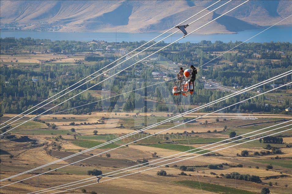 High-voltage transmission line workers in Turkey's Van