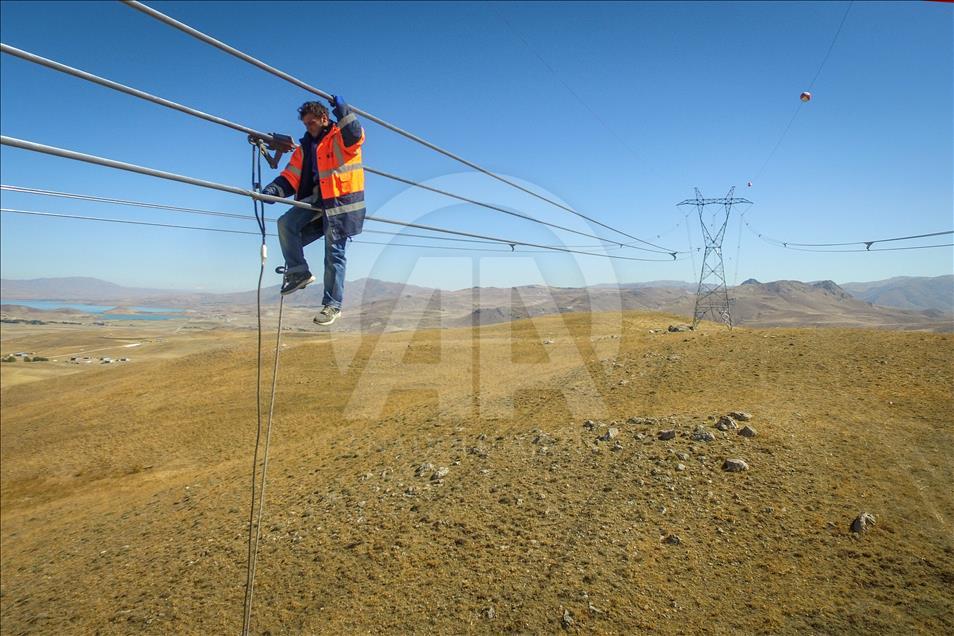 High-voltage transmission line workers in Turkey's Van
