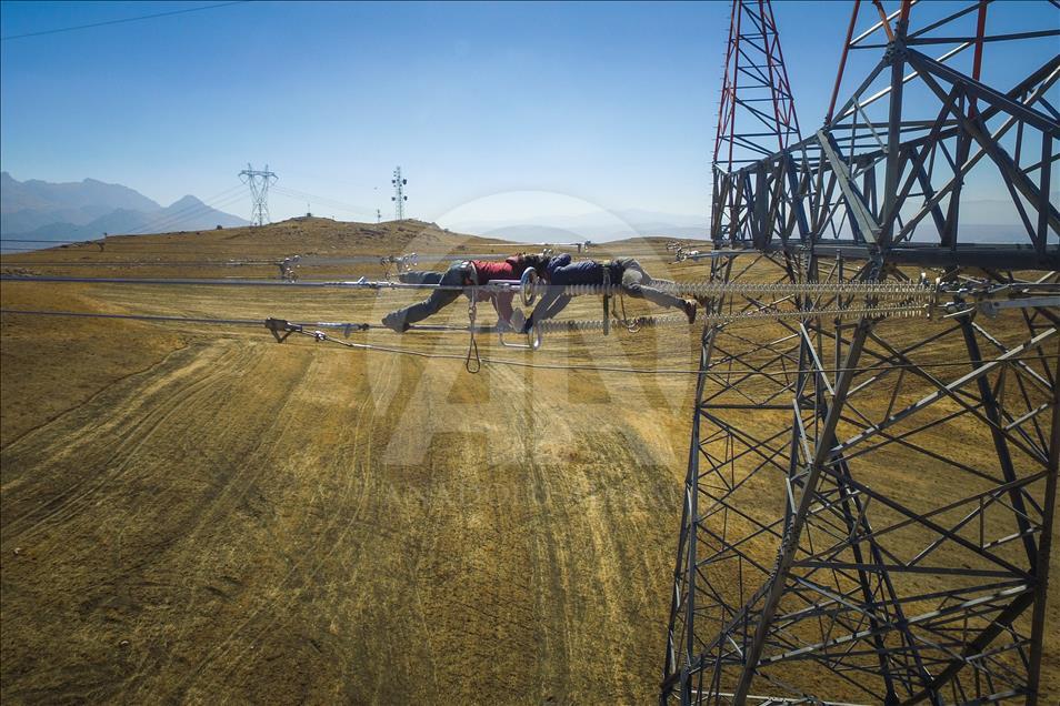 High-voltage transmission line workers in Turkey's Van