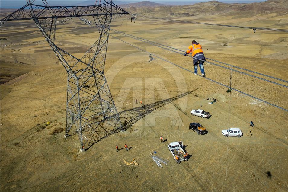 High-voltage transmission line workers in Turkey's Van