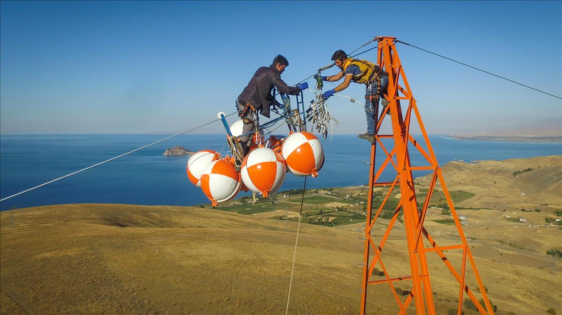 High-voltage transmission line workers in Turkey's Van