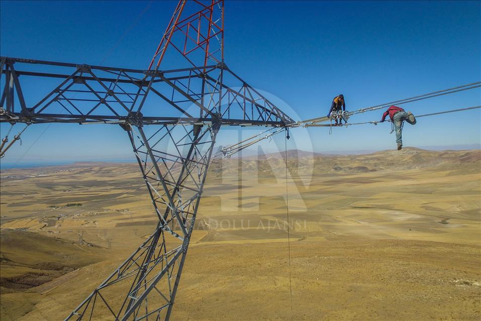 High-voltage transmission line workers in Turkey's Van