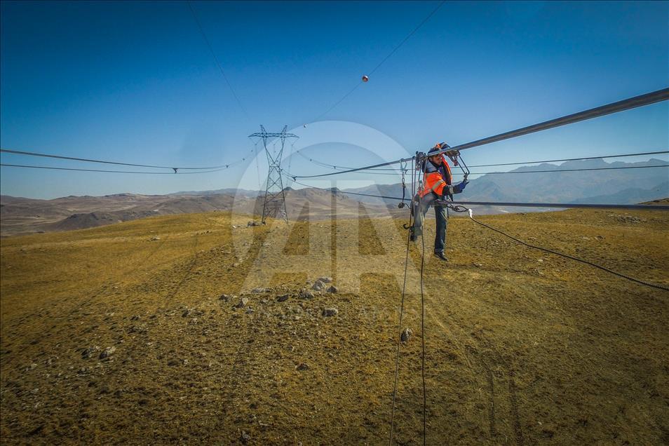 High-voltage transmission line workers in Turkey's Van