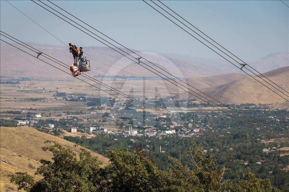 High-voltage transmission line workers in Turkey's Van