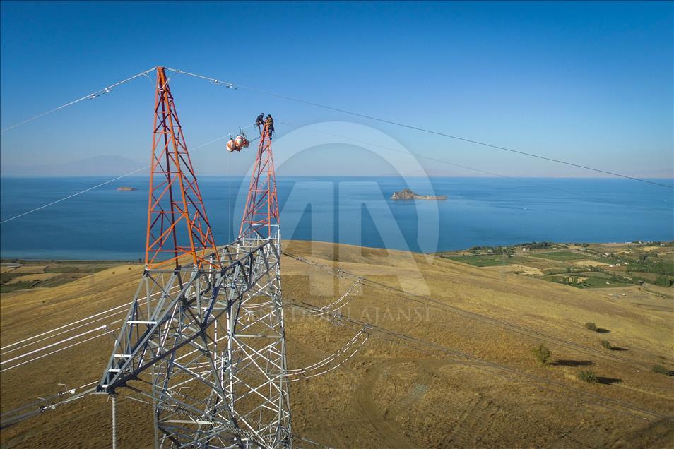 High-voltage transmission line workers in Turkey's Van