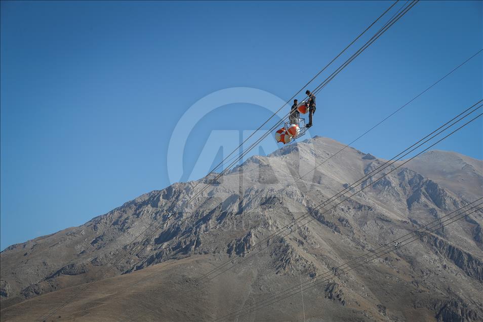 High-voltage transmission line workers in Turkey's Van