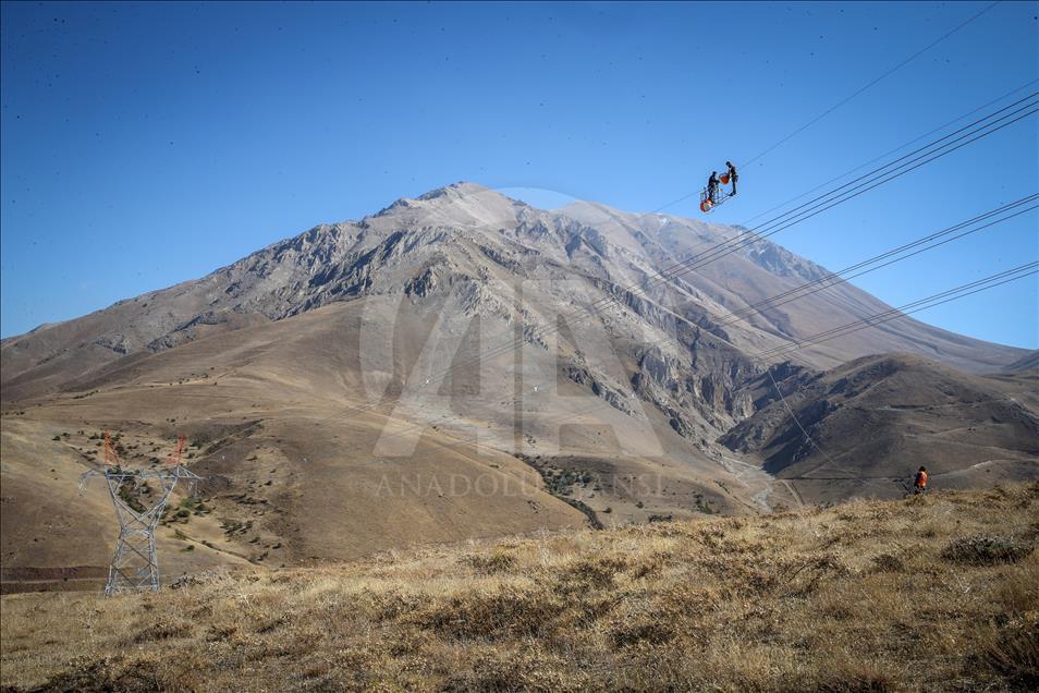High-voltage transmission line workers in Turkey's Van