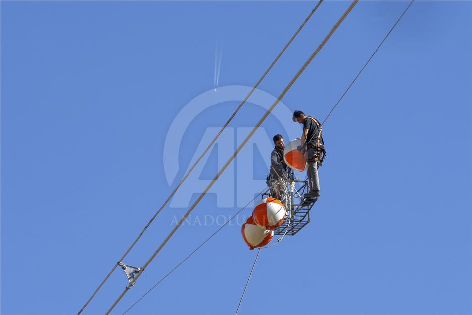 High-voltage transmission line workers in Turkey's Van