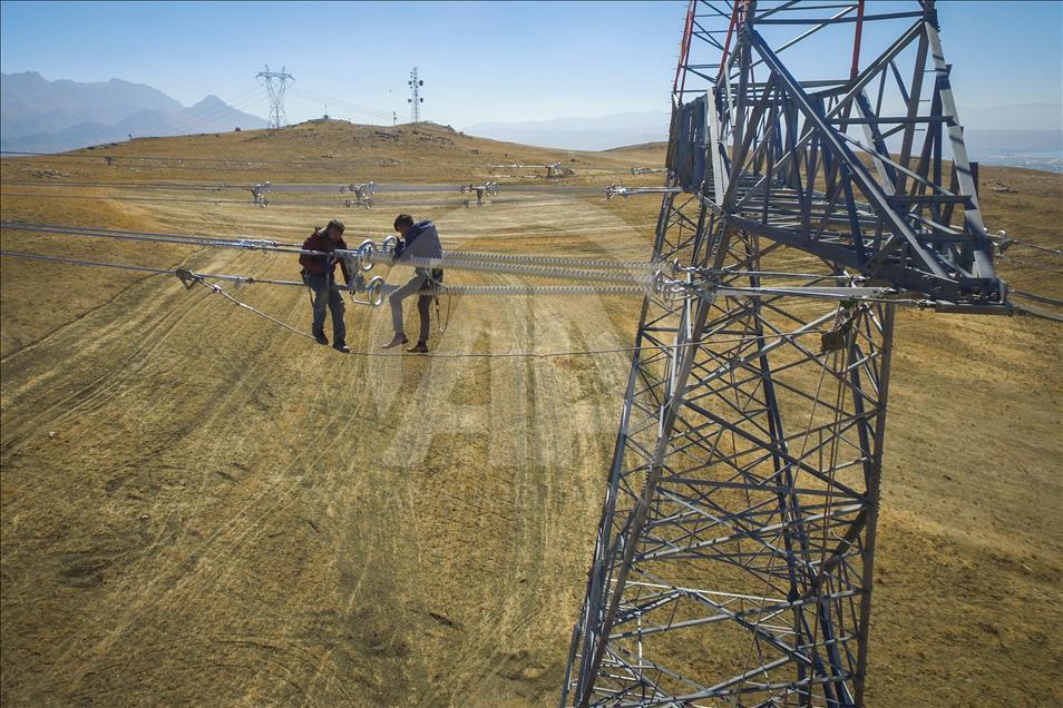 High-voltage transmission line workers in Turkey's Van