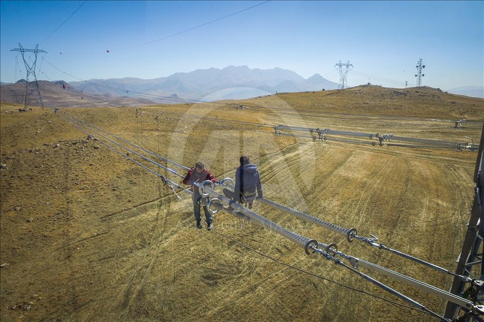 High-voltage transmission line workers in Turkey's Van