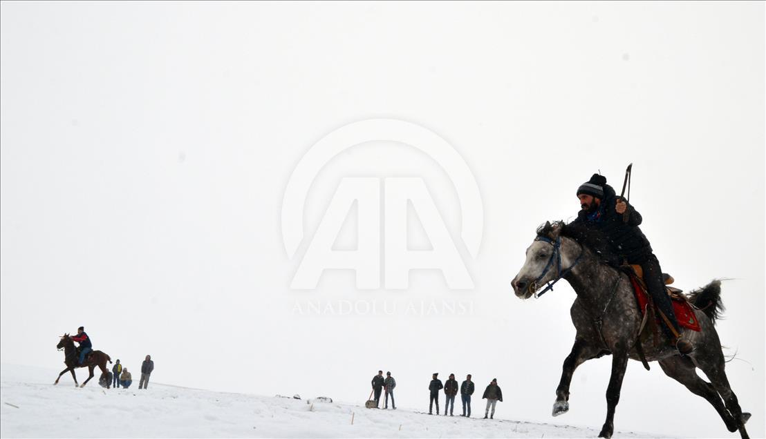 Turkish horse riders perform historical game on snowy ground