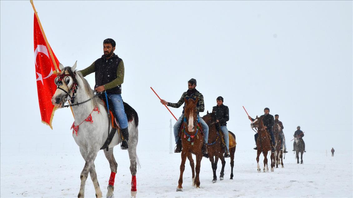 Turkish horse riders perform historical game on snowy ground