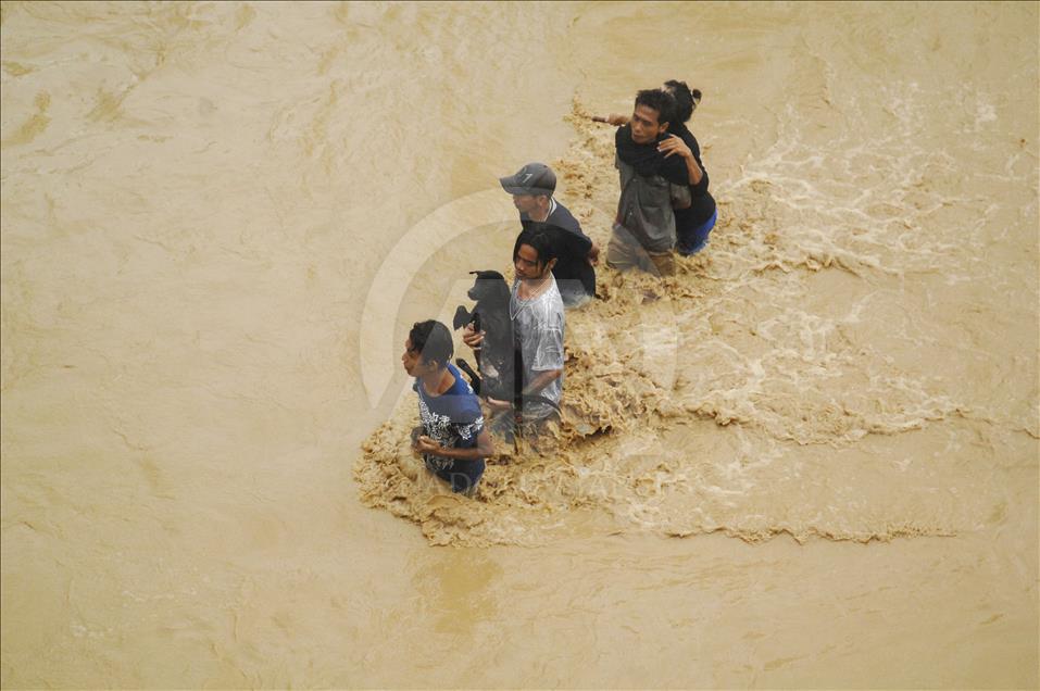 Residents; flood; rescue; dog; village; Danareja; Brebes; Central Java; homes; agricultural lands; heavy rain; Cisanggarung river floods; deforestation