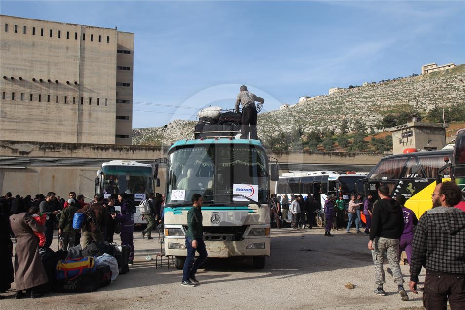 Syrian civilians are evacuated from Al Qadam region of Damascus
