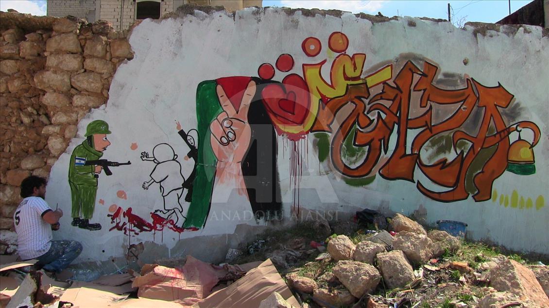 Sirijac grafitima na ruševinama Idliba šalje podršku Palestini