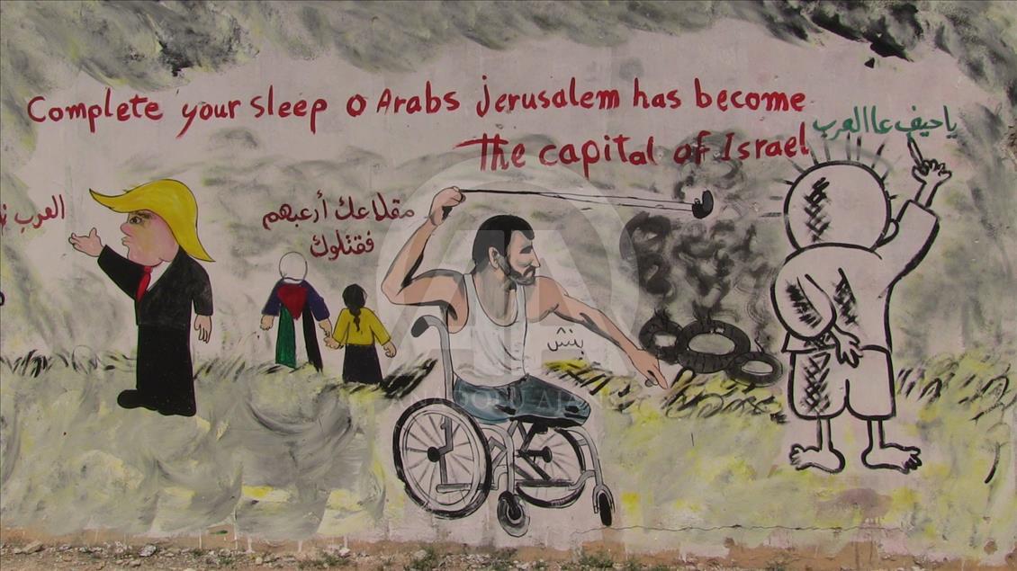 Grafitti hasil karya seniman Suriah, Aziz al Asmar