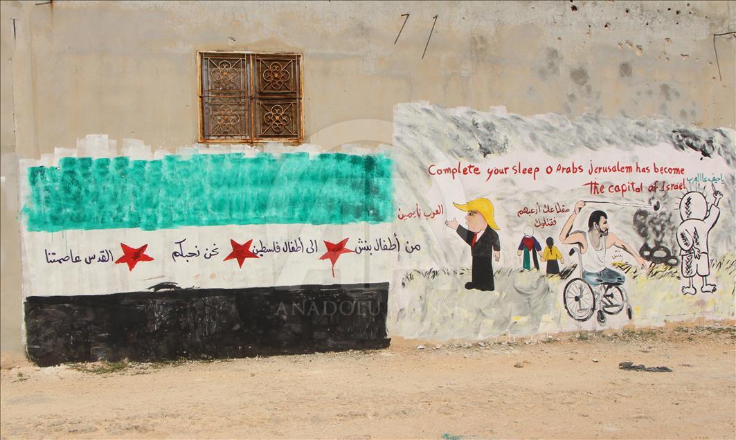 Grafitti hasil karya seniman Suriah, Aziz al Asmar