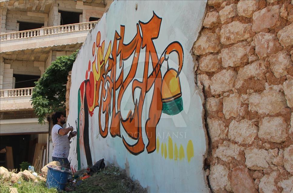Grafitti hasil karya seniman Suriah, Aziz al Asmar