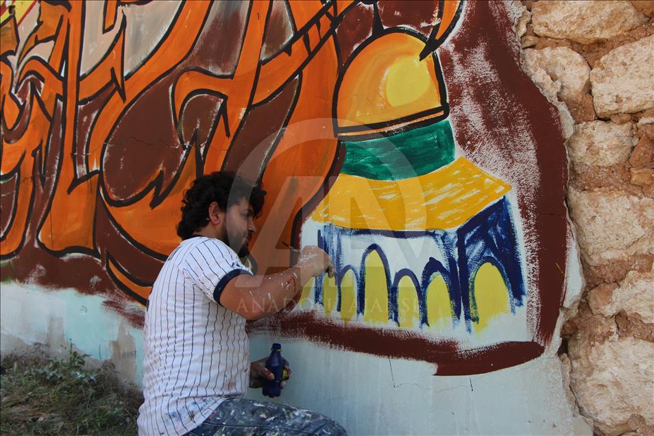 Grafitti hasil karya seniman Suriah, Aziz al Asmar