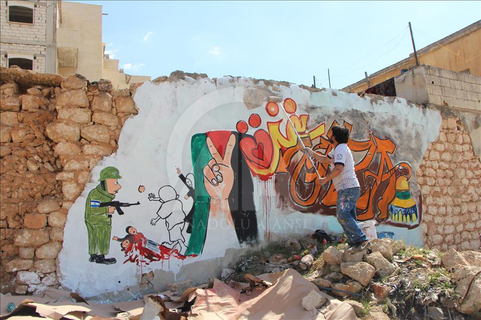 Grafitti hasil karya seniman Suriah, Aziz al Asmar