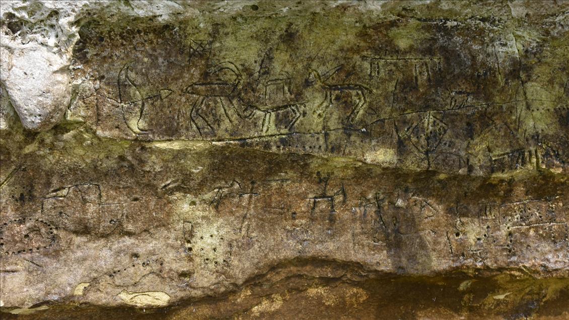 Ancient rock paintings appear after water level drops