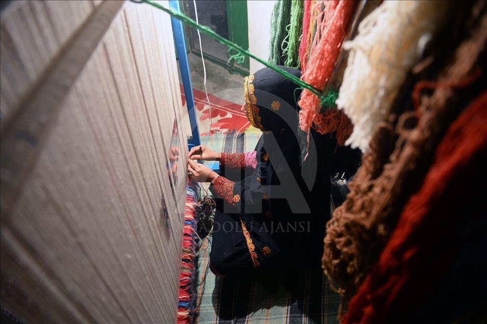 Hand-knotted carpet weaving in Iran