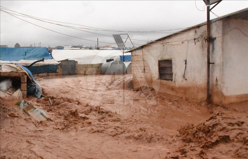 Tent city flooded by rain in Syria