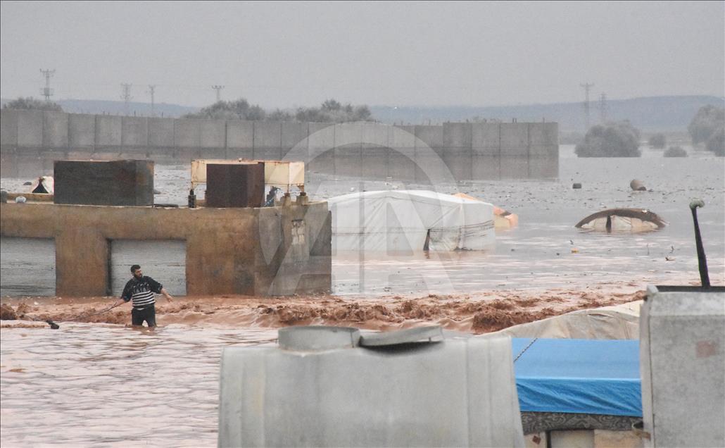 Tent city flooded by rain in Syria