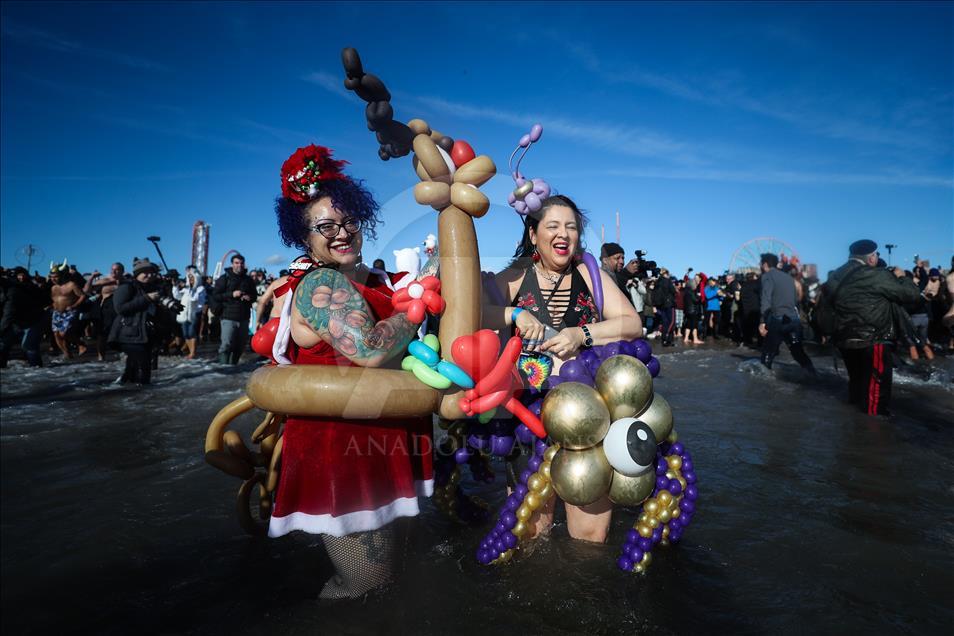 New Yorkers perform polar bear plunge at Coney Island