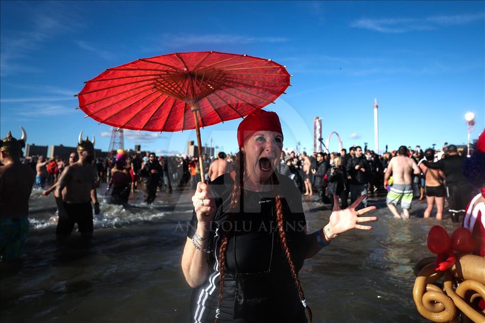 New Yorkers perform polar bear plunge at Coney Island