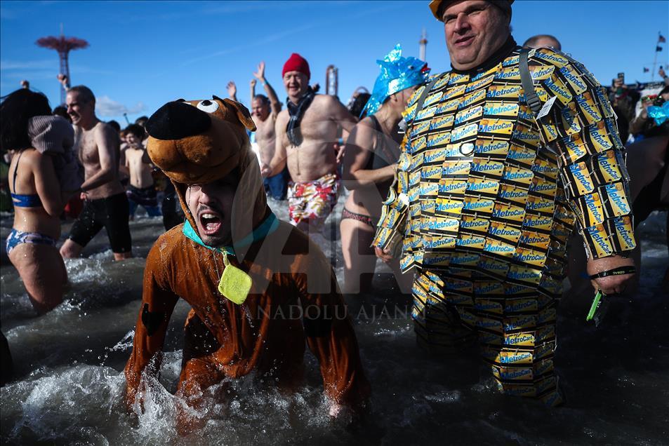 New Yorkers perform polar bear plunge at Coney Island