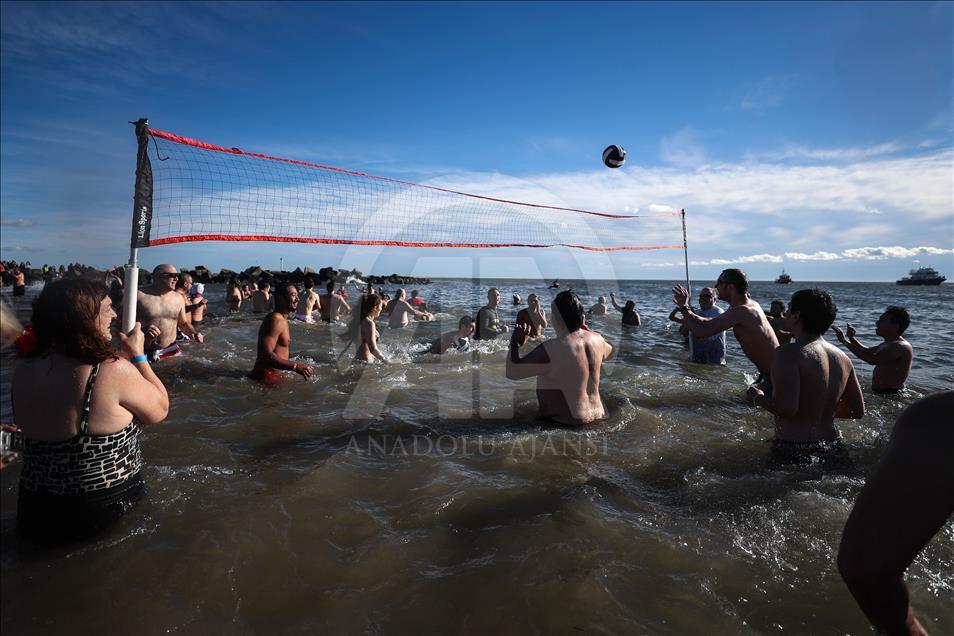 New Yorkers perform polar bear plunge at Coney Island