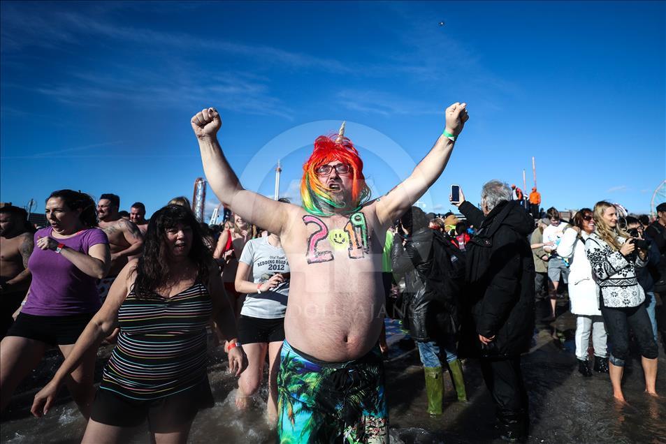 New Yorkers perform polar bear plunge at Coney Island