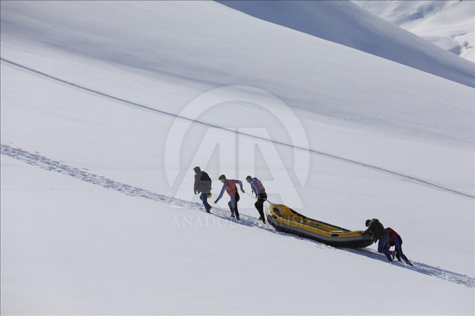 Rafting team practice on a snow covered mountain in Turkey