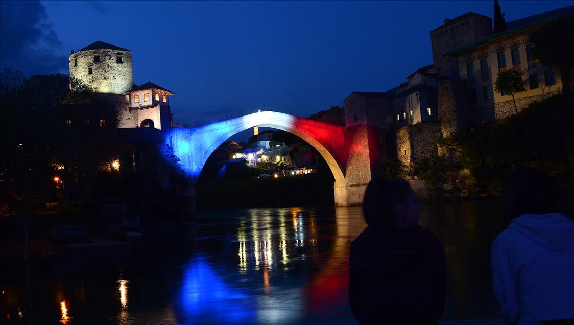 Mostar Bridge is illuminated for the Notre-Dame Cathedral