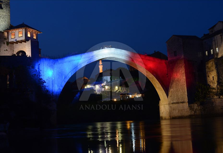 Mostar Bridge is illuminated for the Notre-Dame Cathedral